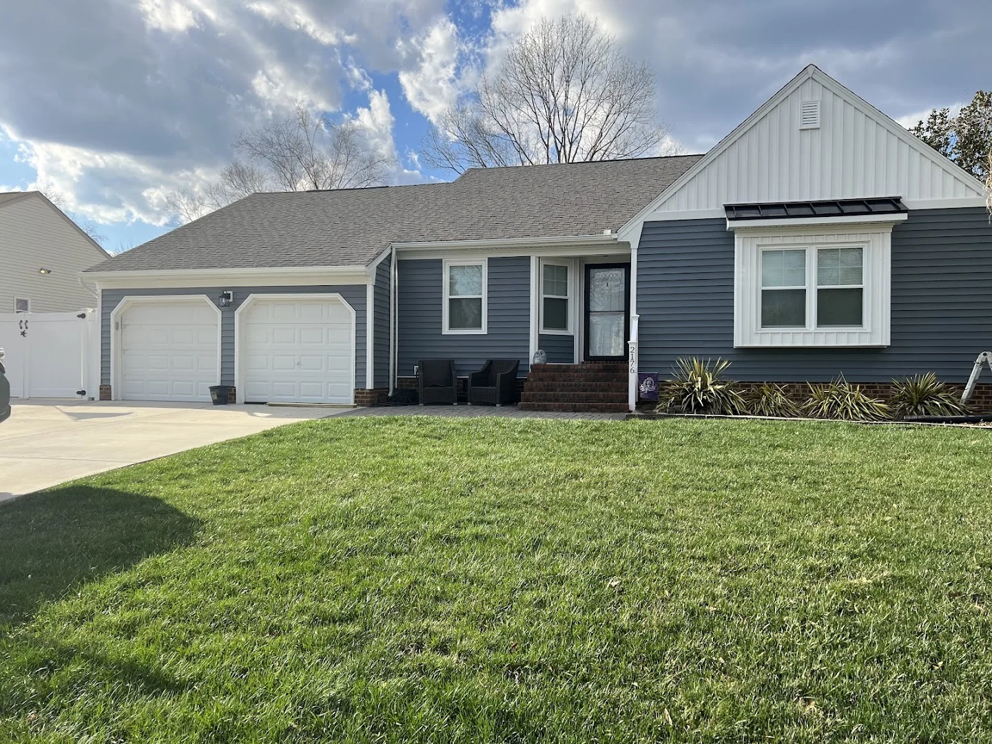 Single-story addition with gray siding