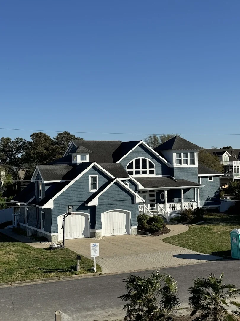 Coastal home addition with covered outdoor living